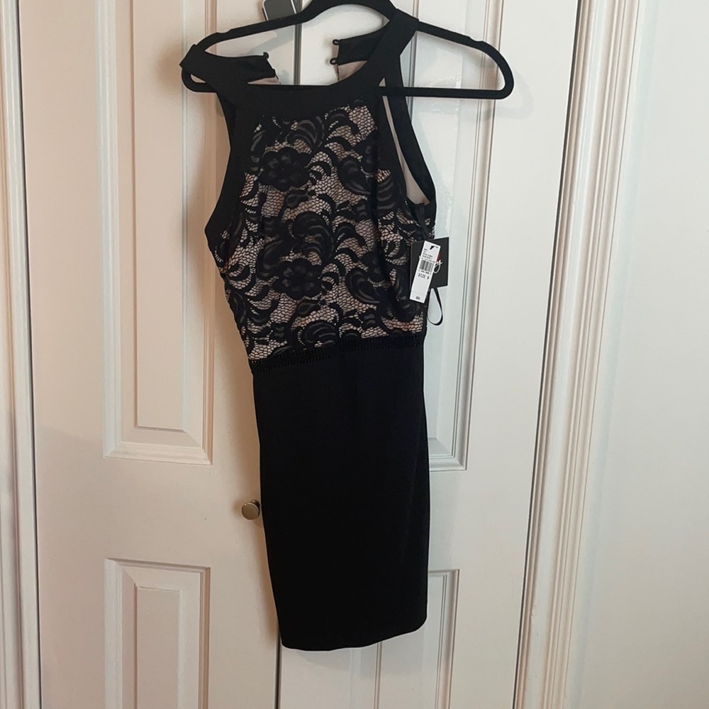 Brand new black lace mini dress with tags. Size 9.